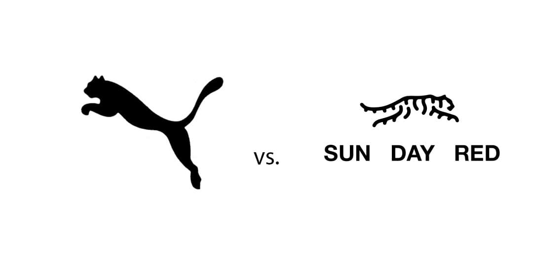 Silhouette comparison of a Puma and a tiger with the words "vs.", "SUN", "DAY", and "RED" highlighting design elements.
